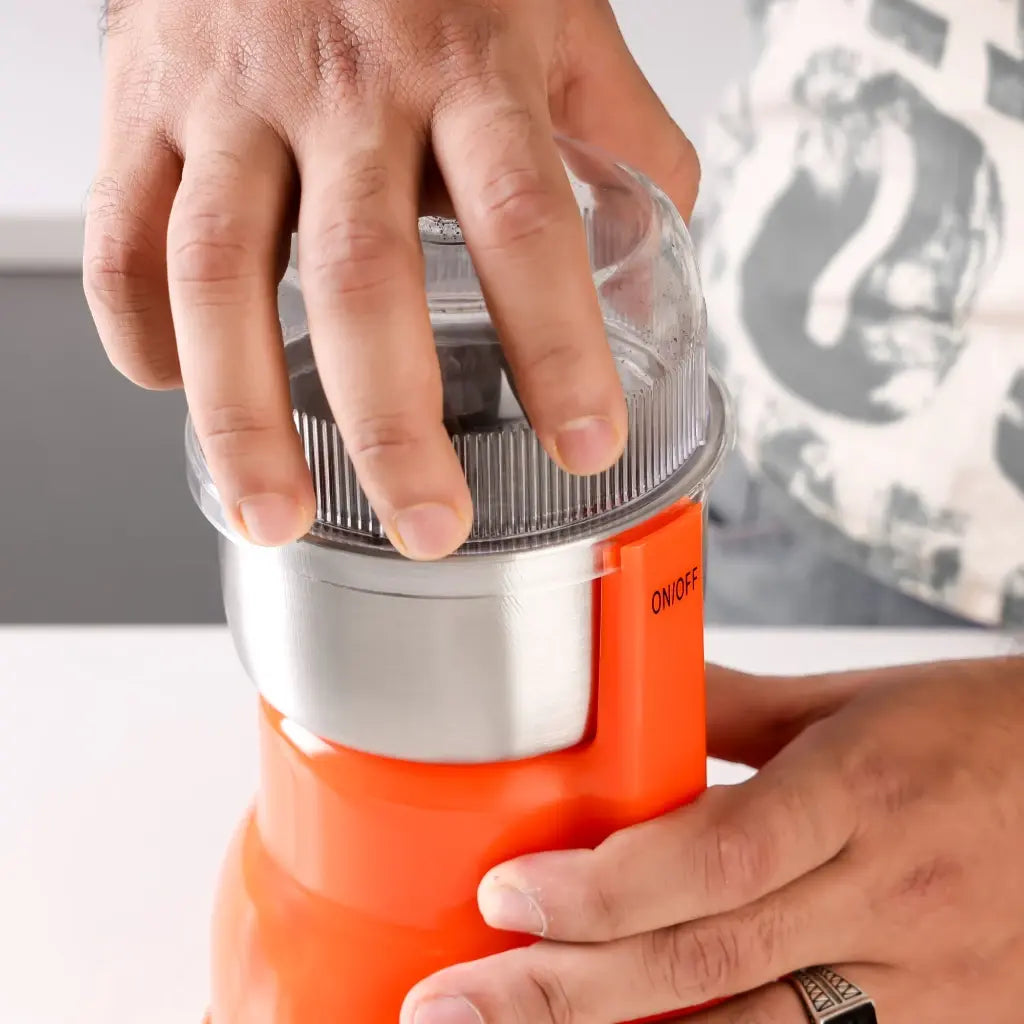 Geepas Electric Coffee Grinder – 300W Powerful Motor with Overheat Protection, Stainless Steel Blades & Bowl | Press-to-Grind Function, 150g Capacity for Coffee Beans, Spices, Nuts & More – GCG5440N – Orange - Damoo