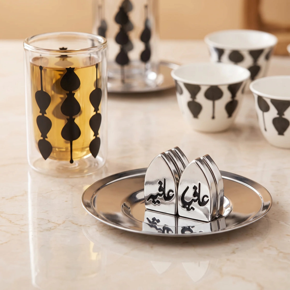 Fashion Home Elegant 18-Piece Tea and Coffee Set with Double-Wall Glass Cups, Metallic Saucers, Black Abstract Pattern and Arabic Ornaments