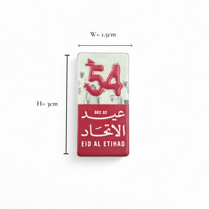 UAE 54th National Day Magnetic Pin – “Eid Al Etihad” Red & White Commemorative Badge with Arabic & English Design | H(3cm) x W(1.5cm) - Damoo