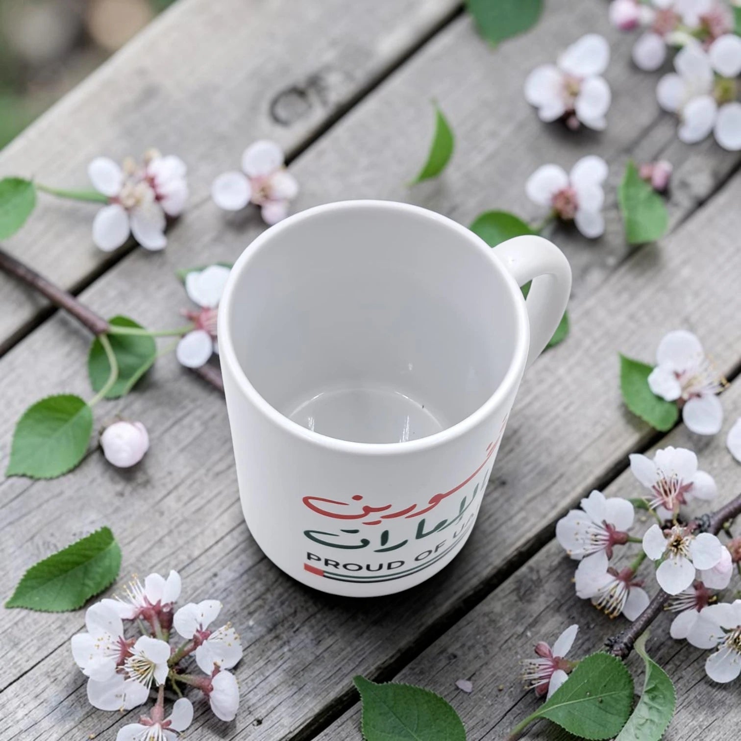 Proud of UAE Ceramic Coffee Mug with Arabic Calligraphy, National Day Celebration Tea Cup, 325ml Ceramic Drinking Mug for Home, Office and Gift Giving (9H x 12L x 8W CM)