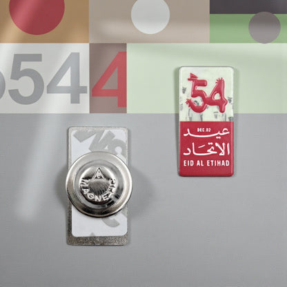 UAE 54th National Day Magnetic Pin – “Eid Al Etihad” Red & White Commemorative Badge with Arabic & English Design | H(3cm) x W(1.5cm) - Damoo