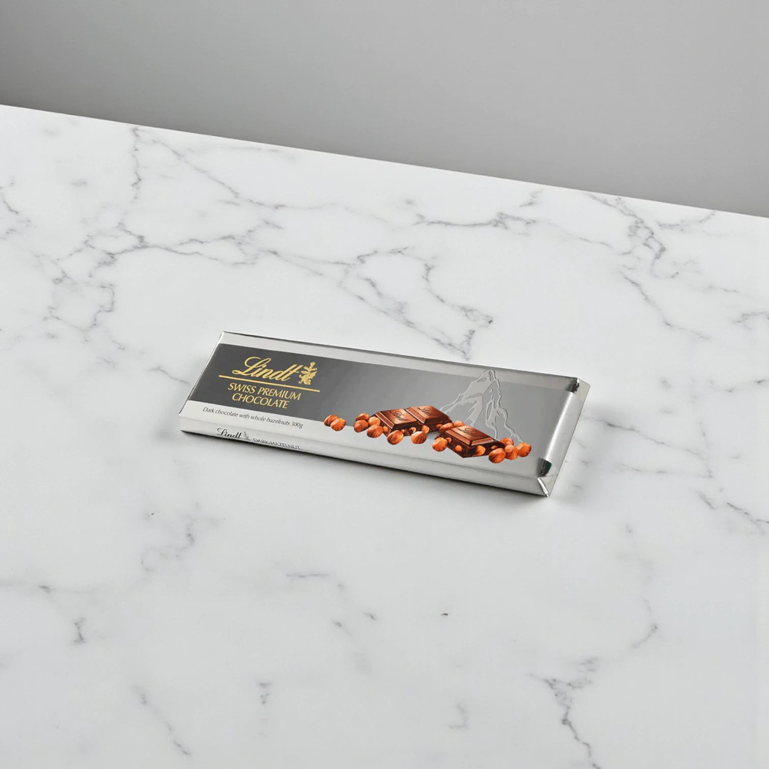 Lindt Swiss Premium Dark Chocolate Bar with Whole Roasted Hazelnuts, 300g – Gourmet Silver Pack, Intense Dark Chocolate, Vegetarian Gift Option - Damoo