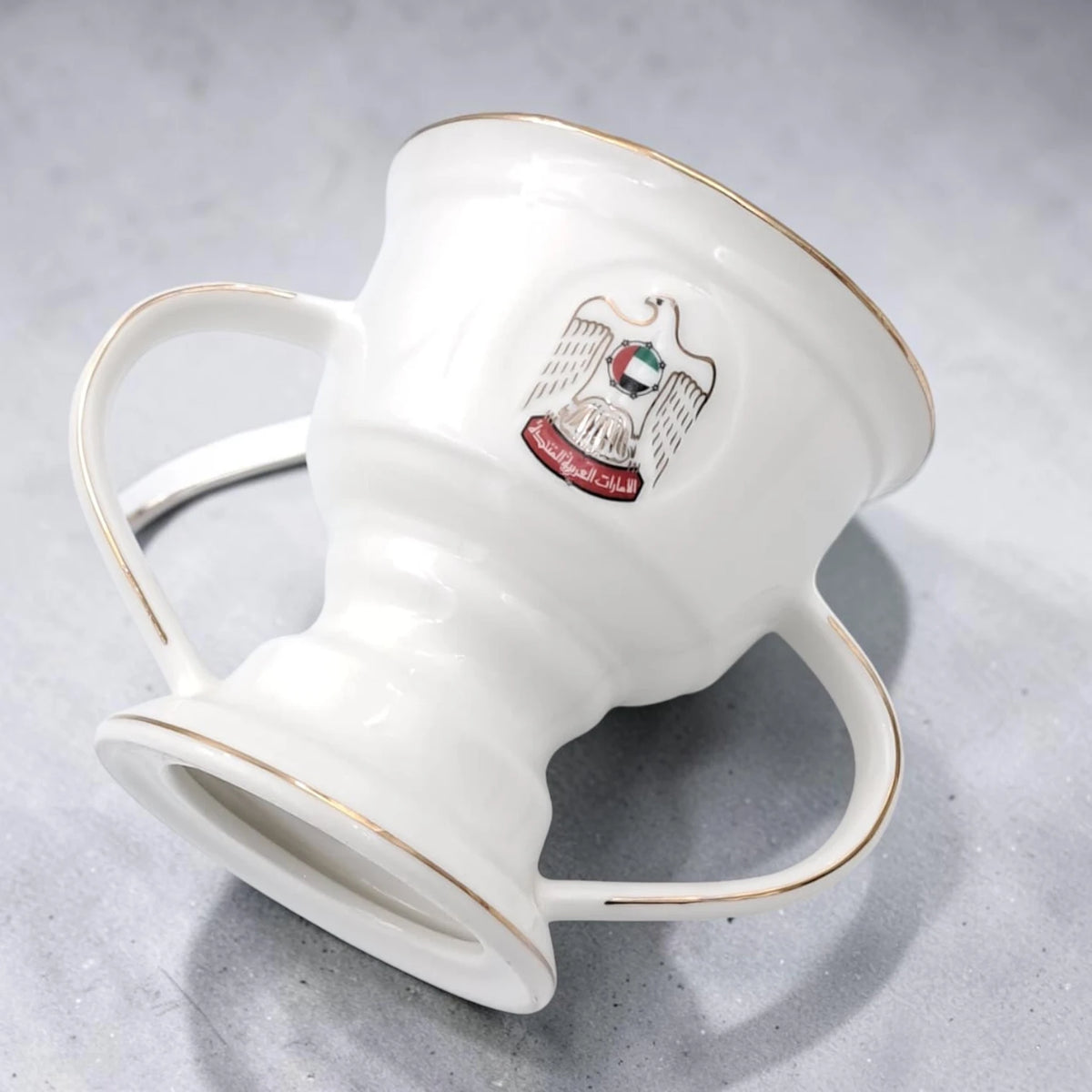 UAE National Emblem Double Handle Serving Cup with Gold Strainer Insert and Decorative Rim (13H x 16L x 12W CM) - Damoo