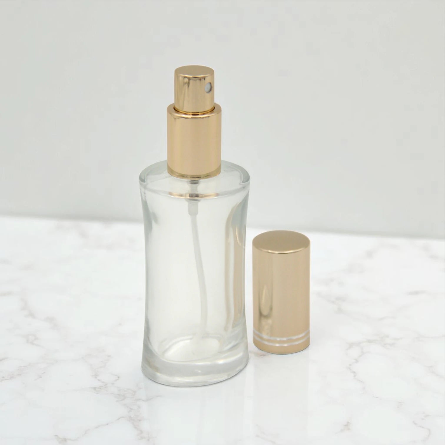 Empty Perfume Bottle 50 ML – Refillable Clear Glass Spray Bottle with Shiny Gold Cap | Elegant Atomizer for Perfumes, Sprays & Essential Oils - Damoo