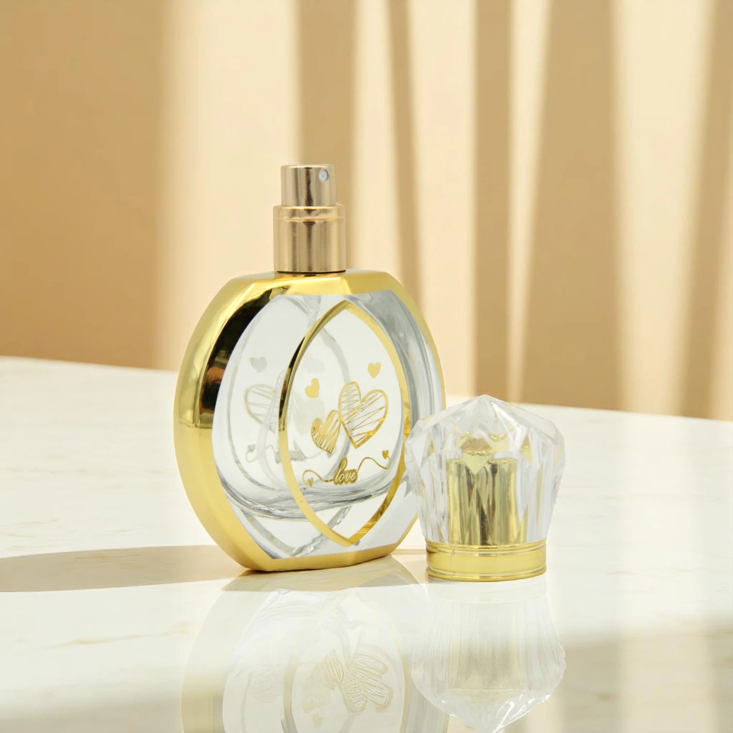 Empty Refillable Perfume Bottle 50 ML – Clear Spray Bottle with Gold Heart Design & “Love” Print | Refillable Bottle for Fragrance & Essential Oils - Damoo