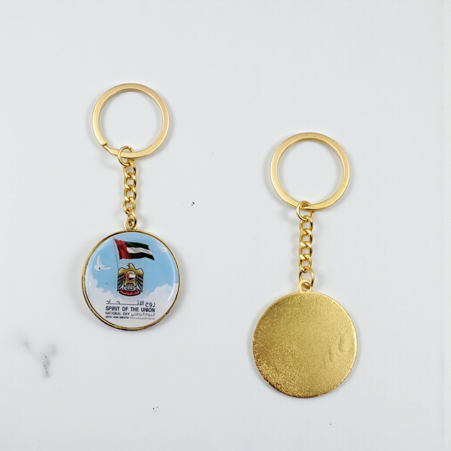 UAE “Spirit of the Union” National Day Keychain – Round Gold Metal Key Ring with Flag & Emblem Design | Patriotic Souvenir Gift for UAE National Day, 9.5cm x 3.5cm - Damoo