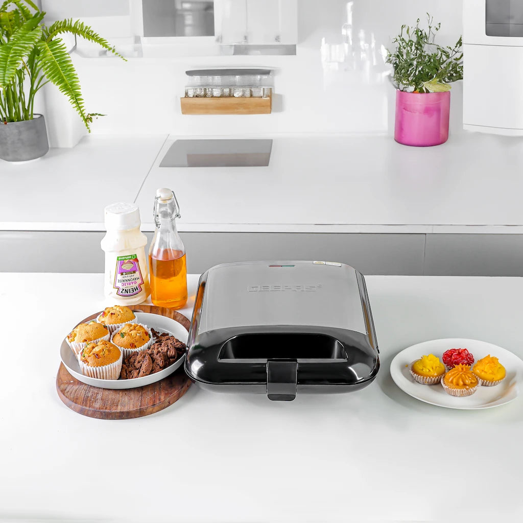 Geepas 1400W 12-Piece Mini Cake Maker GCM3762N – Compact Electric Pie & Cupcake Maker with Non-Stick Plates, Power & Ready Indicators, Cool Touch Handle & Non-Slip Feet – Fast & Easy Baking Machine - Damoo