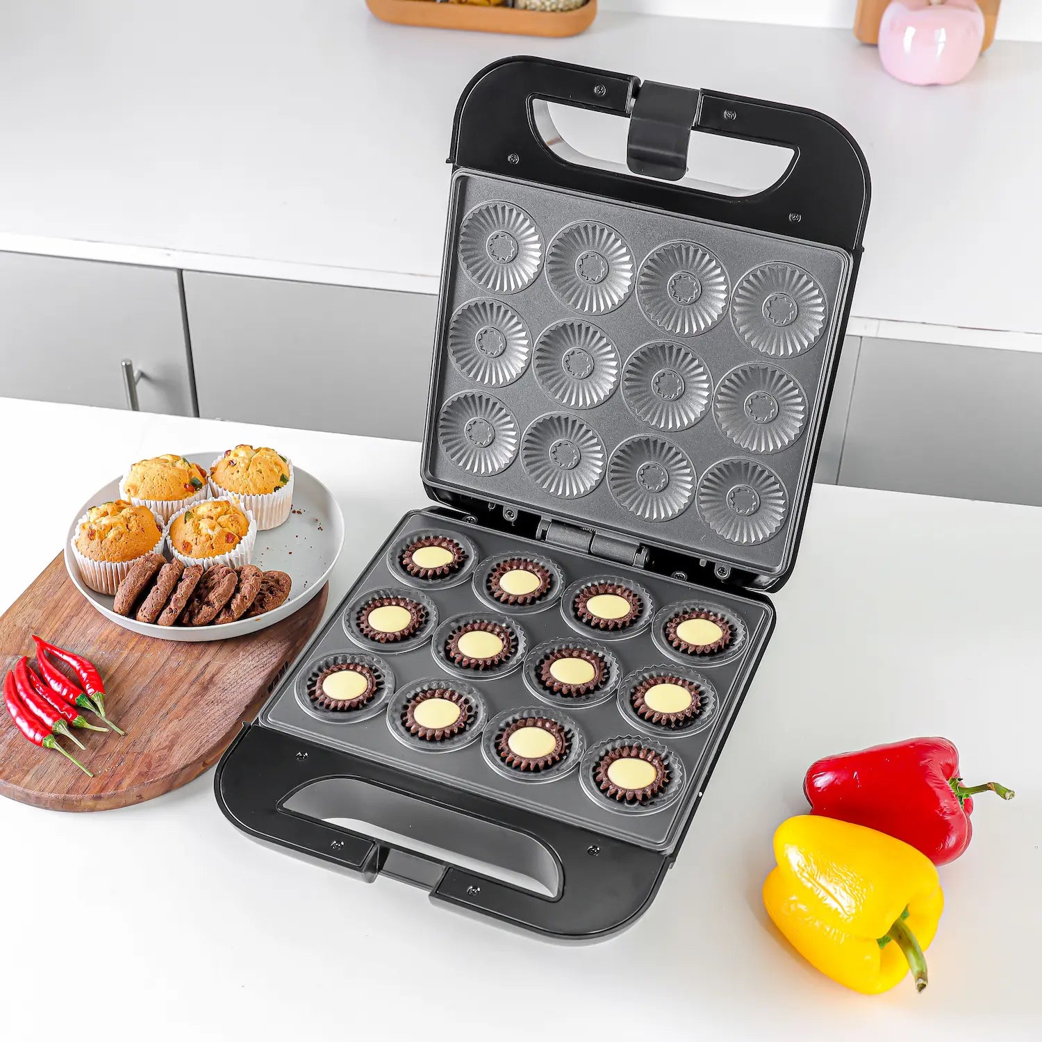 Geepas 1400W 12-Piece Mini Cake Maker GCM3762N – Compact Electric Pie & Cupcake Maker with Non-Stick Plates, Power & Ready Indicators, Cool Touch Handle & Non-Slip Feet – Fast & Easy Baking Machine - Damoo