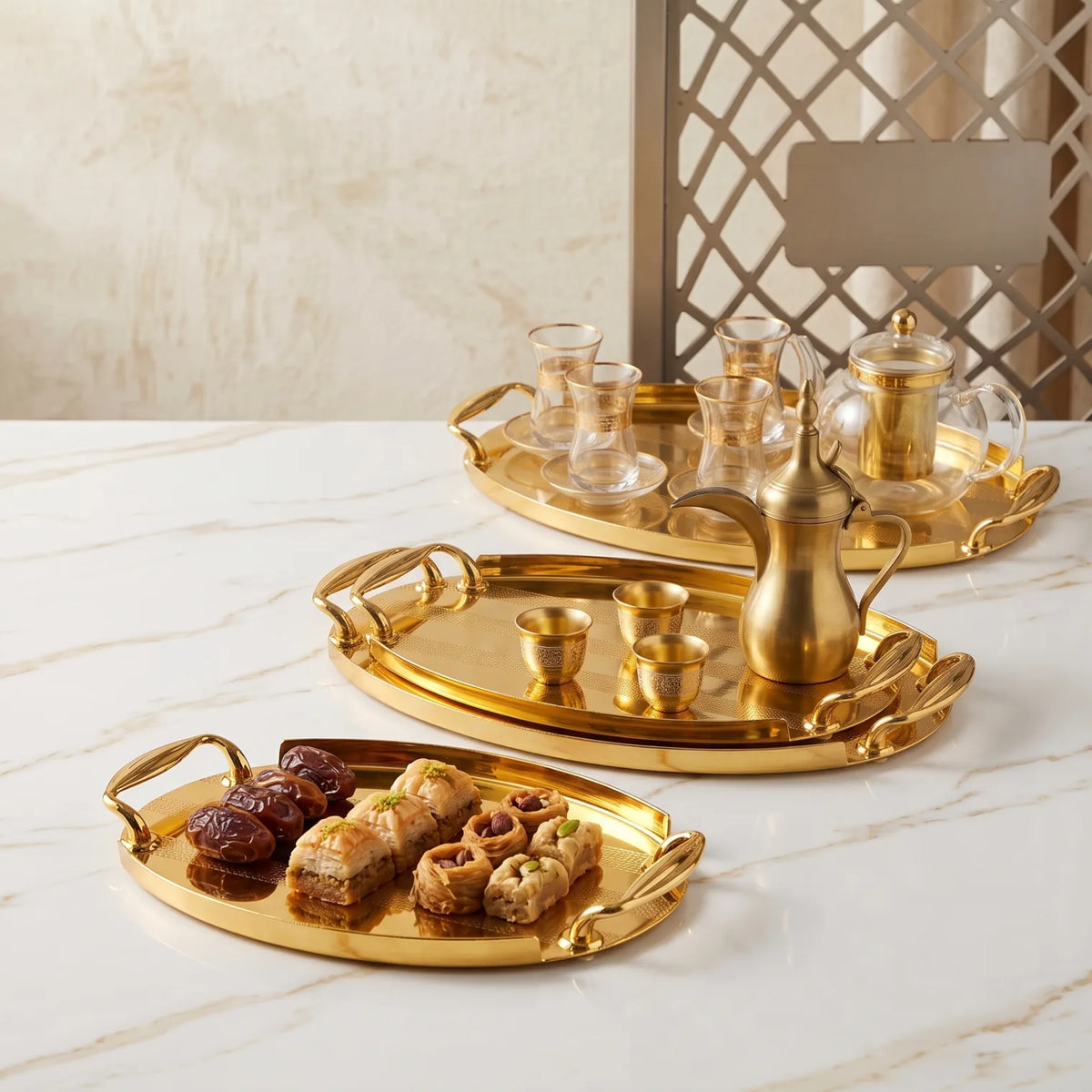 Ansa 3-Piece Glossy Golden Oval Metal Serving Tray Set | Textured Handles and Striped Surface Patterns
